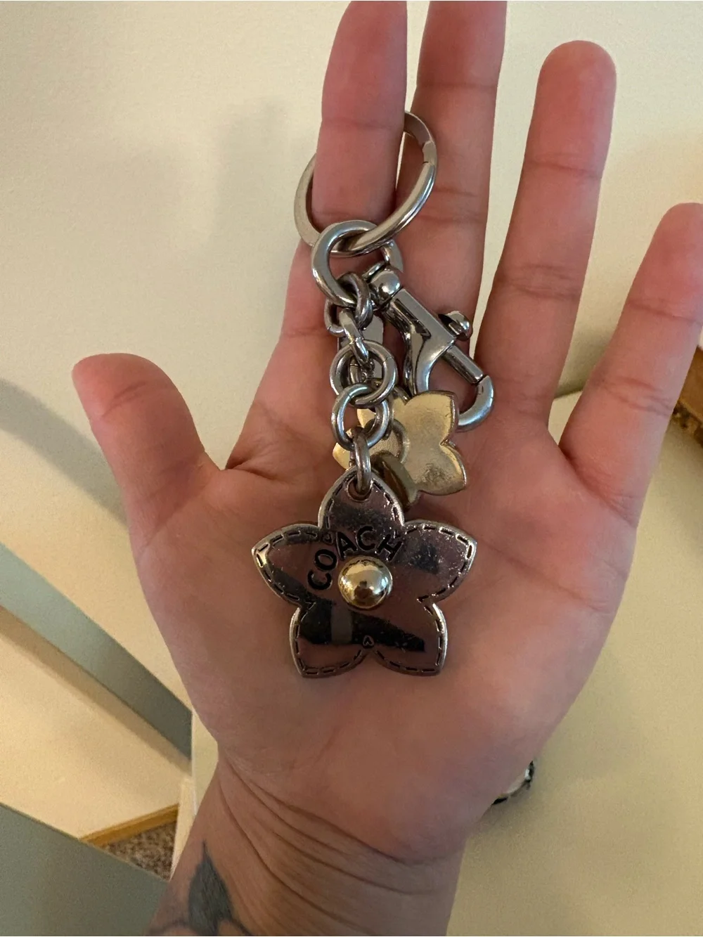 COACH Silver & Bronze Flower Charm Key Ring with Silver Hardware